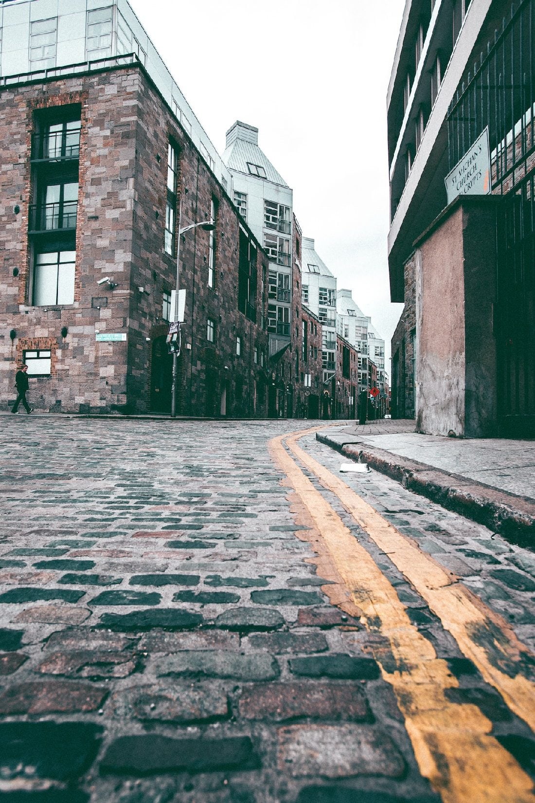 Brown and grey building off brick road in Dublin